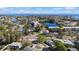 Aerial view of waterfront community showcasing homes, waterways, and lush landscaping at 4666 Helena Ne St, St Petersburg, FL 33703