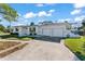 Ranch style home with a two-car garage and mature landscaping at 4666 Helena Ne St, St Petersburg, FL 33703