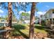 Side yard with mature trees and grassy area at 4666 Helena Ne St, St Petersburg, FL 33703
