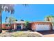 Attractive single-story home with a two-car garage and lush landscaping at 1285 79Th St S, St Petersburg, FL 33707