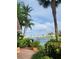 Scenic waterfront view featuring a vibrant rainbow, lush landscaping, and inviting community amenities at 1285 79Th St S, St Petersburg, FL 33707