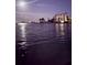 Scenic waterfront view with buildings and the moon reflected in the calm water at night at 1285 79Th St S, St Petersburg, FL 33707