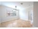 Bright dining room with tile floors and a chandelier at 1509 Riverside Dr, Tarpon Springs, FL 34689