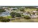 Aerial view of waterfront community with marina and walking paths at 1843 Lake Cypress Dr, Safety Harbor, FL 34695