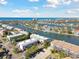 Aerial view of waterfront community with multiple buildings and waterway access at 322 Windrush Blvd # 4, Indian Rocks Beach, FL 33785