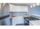 Updated kitchen, featuring white cabinets and quartz countertops at 3315 58Th S Ave # 421, St Petersburg, FL 33712