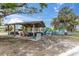 Wooden picnic pavilion with tables and benches, near playground at 3606 Belle Vista E Dr, St Pete Beach, FL 33706