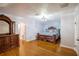 Spacious bedroom with wood floors, a large bed, and decorative dresser at 37439 Meridian Ave, Dade City, FL 33525