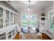 Bright breakfast nook featuring built-in cabinets, a window view, and seating for four at 37439 Meridian Ave, Dade City, FL 33525