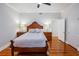 Spacious main bedroom with hardwood floors and en-suite bathroom access at 37439 Meridian Ave, Dade City, FL 33525