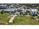Aerial view of a hotel with a large pool and lush landscaping near the waterfront at 381 Estero Ct, Safety Harbor, FL 34695