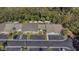 Aerial view of townhouses with parking and lush green surroundings at 381 Estero Ct, Safety Harbor, FL 34695