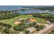 Aerial view of a park featuring multiple baseball fields, a skate park, and a playground, located near a waterfront at 381 Estero Ct, Safety Harbor, FL 34695