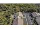 An aerial view of the property highlighting the landscaping, parking, and outdoor space at 381 Estero Ct, Safety Harbor, FL 34695