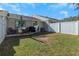 Backyard space featuring grass, an outdoor grill, and seating at 381 Estero Ct, Safety Harbor, FL 34695