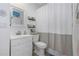 Updated bathroom with a white vanity and a shower curtain at 381 Estero Ct, Safety Harbor, FL 34695