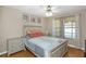 Comfortable bedroom featuring natural light, ceiling fan, and tasteful decorations at 381 Estero Ct, Safety Harbor, FL 34695