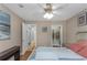 Bedroom with a ceiling fan and views of the closet and hallway at 381 Estero Ct, Safety Harbor, FL 34695