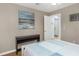 Cozy bedroom featuring a contemporary painting above a table and an interior door at 381 Estero Ct, Safety Harbor, FL 34695