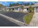 Pleasant exterior view of a townhouse with driveway parking and lush landscaping at 381 Estero Ct, Safety Harbor, FL 34695
