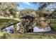 Charming gazebo with a wooden bridge over a tranquil pond, offering a serene escape at 381 Estero Ct, Safety Harbor, FL 34695