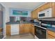 Functional kitchen with matching appliances and ample storage space, offering convenience and style at 381 Estero Ct, Safety Harbor, FL 34695