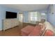Cozy living room with comfortable seating, tv, and natural light at 381 Estero Ct, Safety Harbor, FL 34695