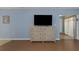 Living room with a TV stand and view into another room at 381 Estero Ct, Safety Harbor, FL 34695