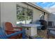Outdoor patio with fire pit, chairs, and grill. Great for entertaining at 381 Estero Ct, Safety Harbor, FL 34695