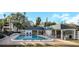 Community pool with lounge chairs, offering a perfect spot for relaxation and enjoying the beautiful surroundings at 381 Estero Ct, Safety Harbor, FL 34695