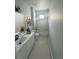 Clean bathroom with a bathtub, vanity, and neutral color scheme at 4202 N 15Th St, Tampa, FL 33610