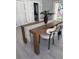 Dining area with a wooden table, stylish chairs, and neutral decor, creating a cozy space at 4202 N 15Th St, Tampa, FL 33610