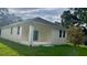 House exterior showcasing back patio and backyard at 4202 N 15Th St, Tampa, FL 33610
