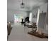 Bright kitchen with white quartz countertops, stainless steel sink, and modern black lighting fixtures at 4202 N 15Th St, Tampa, FL 33610