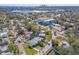 Bird's-eye view of the home nestled within the neighborhood near the water at 4231 Shore Acres Ne Blvd, St Petersburg, FL 33703