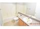 Clean bathroom with a bathtub, shower, and updated vanity at 504 Maple Pointe Dr, Seffner, FL 33584