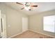 Well-lit bedroom featuring a ceiling fan and closet at 504 Maple Pointe Dr, Seffner, FL 33584