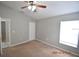 Spacious bedroom with ceiling fan and window at 504 Maple Pointe Dr, Seffner, FL 33584