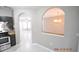 Kitchen with granite countertops, dark cabinets, and view into dining area at 504 Maple Pointe Dr, Seffner, FL 33584