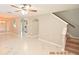 Open living room with marble floors and staircase at 504 Maple Pointe Dr, Seffner, FL 33584