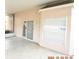 Covered patio with tile flooring, sliding glass door, and window with blinds at 504 Maple Pointe Dr, Seffner, FL 33584