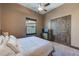 Bright bedroom featuring a cozy bed, built-in closet, and TV at 5418 Oakhurst Dr, Seminole, FL 33772