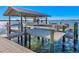 Covered boat lift on a spacious dock at 5418 Oakhurst Dr, Seminole, FL 33772