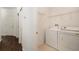 Laundry room with washer, dryer, and shelving at 5722 Autumn Shire Dr, Zephyrhills, FL 33541