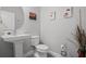 Clean and modern bathroom with pedestal sink and toilet at 5805 Grand Sonata Ave, Lutz, FL 33558