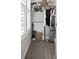 Walk-in closet with ample shelving and hanging space at 5805 Grand Sonata Ave, Lutz, FL 33558