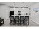 Modern kitchen with island, stainless steel appliances, and white cabinets at 5805 Grand Sonata Ave, Lutz, FL 33558