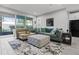 Spacious living area with comfy seating and a large TV at 5805 Grand Sonata Ave, Lutz, FL 33558