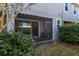 Screened patio with access from sliding glass doors at 5805 Grand Sonata Ave, Lutz, FL 33558