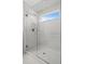 Large walk in shower with glass enclosure and window at 5805 Grand Sonata Ave, Lutz, FL 33558